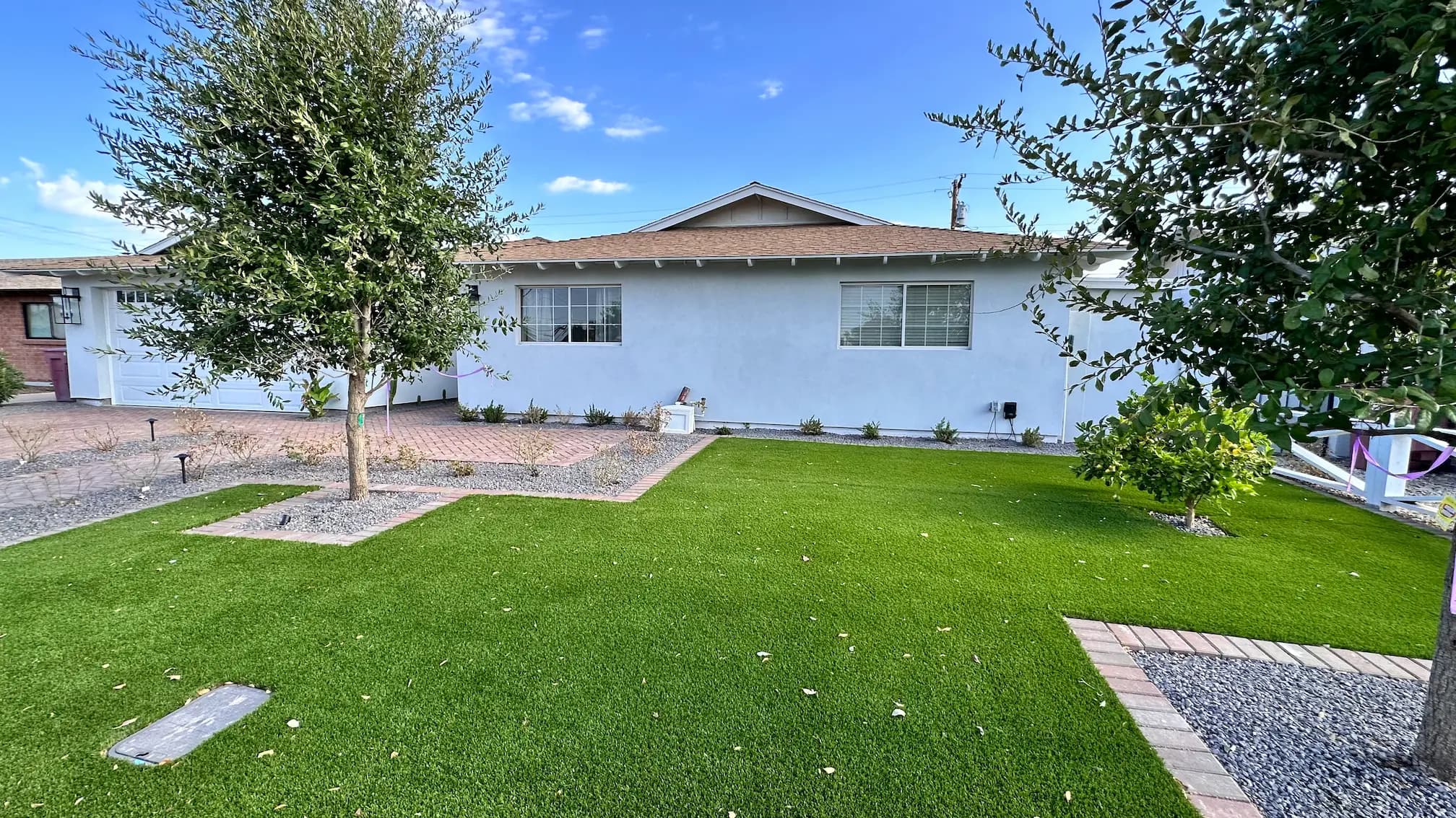 Single-story Arizona home with a new front lawn after a Masizo project