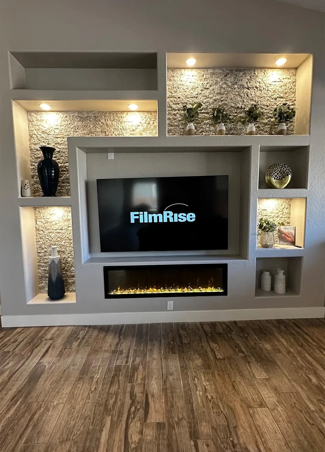 Built-in media wall with a fireplace on a Masizo job